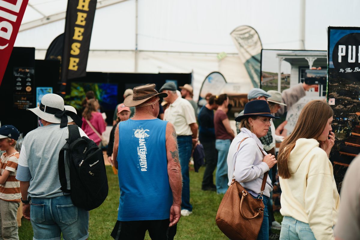 A busy exhibitor marquee